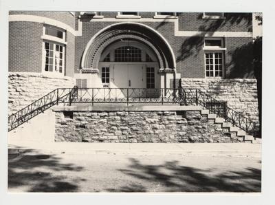 The entrance and doorway of the Gillis Building from the exterior.  It says 
