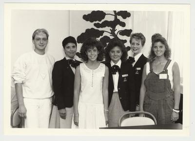 An unidentified man, an unidentified woman, and Amy Martin (far right) are incoming freshman standing with Sandy Curtis (third from right) and two other unidentified female Dean's Ambassadors