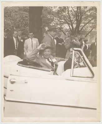 General Dwight Eisenhower (sitting in the car on the left) is campaigning on campus to become President.  Eisenhower became president in 1953