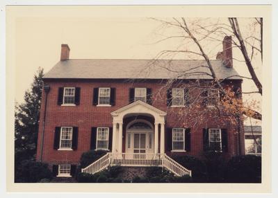 An exterior photograph of the front of a house during the fall