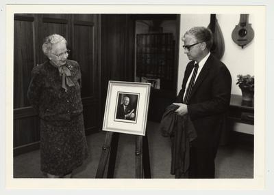 In November 1985 the large meeting room in the King Library Annex was named for the University Fellow, W. Hugh Peal (the image in the center).  Pictured are Mrs. Margaret Peal (left) and Paul Willis (right), Director of Libraries, at the Dedication of the Peal Gallery