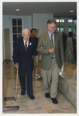 William J. Marshall, Director of Special Collections and Archives (right) is assisting Dr., Thomas D. Clark (left) into Young Library for Thomas D. Clark's 100th birthday celebration