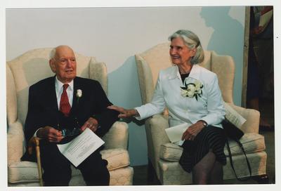 Thomas D. Clark (left) is sitting next to Loretta Brock (right)  at Dr. Thomas D. Clark's 100th birthday celebration at Young Library