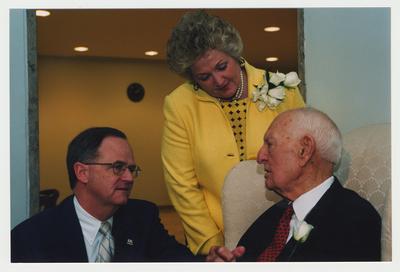 President Lee Todd (left) and Patricia B. Todd (center) are talking with Thomas D. Clark (right)  at Dr. Thomas D. Clark's 100th birthday celebration at Young Library