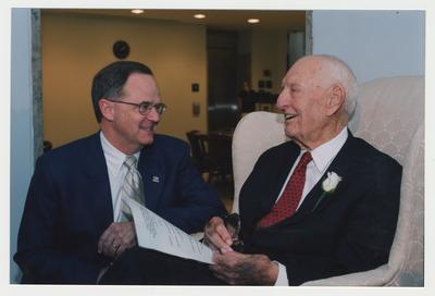 President Lee Todd (left) is talking with Thomas D. Clark (right)  at Dr. Thomas D. Clark's 100th birthday celebration at Young Library