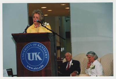 Thomas D. Clark (seated, center) and Loretta Brock (seated, right) are listening to Patricia B. Todd (left) giving opening remarks at Dr. Thomas D. Clark's 100th birthday celebration at Young Library