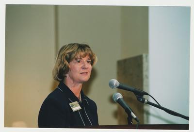 Carol Diedrichs, Dean of Libraries, is speaking at Dr. Thomas D. Clark's 100th birthday celebration at Young Library after receiving the three millionth volume 