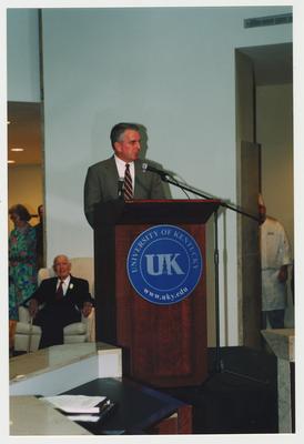Thomas Clark (seated, left) is listening to Carl Nathe, University of Kentucky Public Relations Officer, speak at Dr. Thomas D. Clark's 100th birthday celebration at Young Library