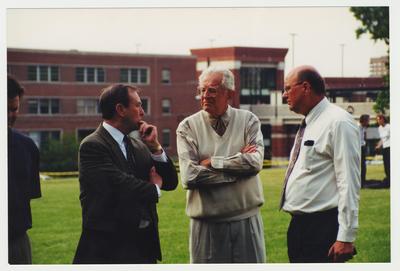President Charles Wethington (right) is talking with  President Emeritus Otis Singletary (center) and Terry Birdwhistell after the Administration / Main Building  fire