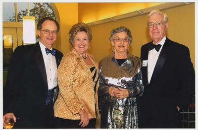 From the left:  President Lee Todd, Patsy Todd, Betty Dickey, and former President Frank Dickey.   They are at a ceremony for the reopening of the Main Building
