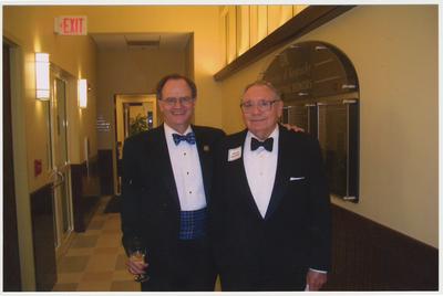 President Lee Todd (left) and Warren Rosenthal are at a ceremony for the reopening of the Main Building