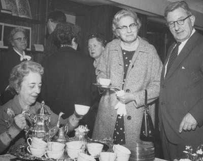 At the dedication of the King Annex, Helen King pouring, Sir Frank Francis (standing), Susan Scholtz (librarian of Asbury Theology Seminary)
