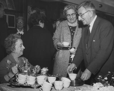 At the dedication of the King Annex, Helen King pouring, Mrs. Thomas C. Underwood (directly behind Miss King), Miss Susan Schultz (with cup in hand), and Sir Frank C. Francis