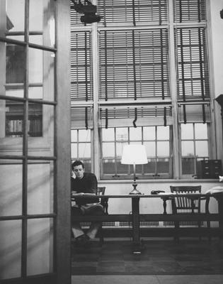 Man studying in the Browsing Room on the second floor of King Library. Received December of 1960 from Public Relations