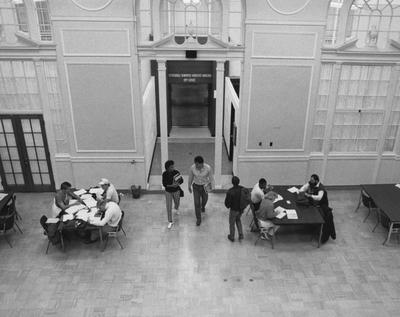 Two unidentified students are walking off the bridge, that connected King North and King South, into the Great Hall on the fourth floor