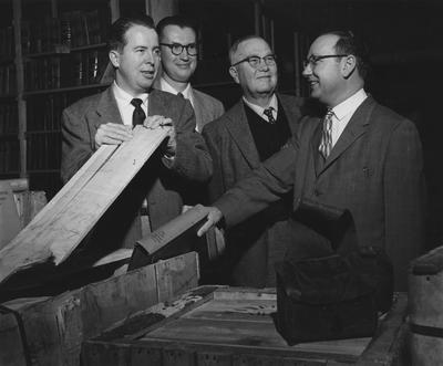 Pictured are Alfred Brandon (left), Dr. Chambers (third from left), Dr. Richardson Noback, Russ White. Received February 6, 1958 from Public Relations