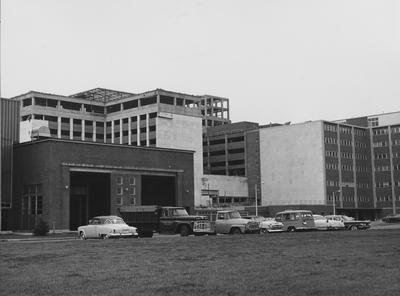 Cars parked in front of Medical Center construction site. Received August of 1960 from Public Relations