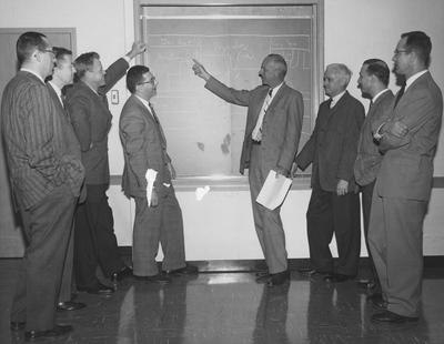 Pictured from the left are: Dr. Alan Ross, Robert E. McCafferty, William Knisely, Robert Straus, Dean William R. Willar, Joseph Parker, Edmund Pellegrino, and George D. Schwert. Received February 5, 1960 from Public Relations