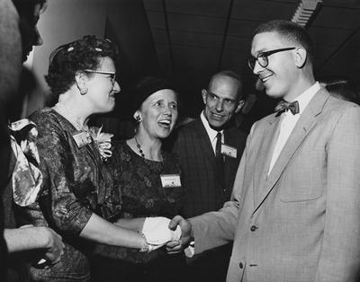 From left to right: Dean Drake, Mrs. William R. Willard, Mr. William R. Willard, and an unidentified man are at the dedication of the Medical Center