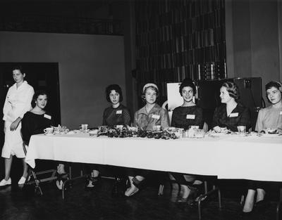 Unidentified women are sitting at a table at the dedication of the Medical Center