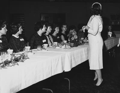 Unidentified women are sitting at a table at the dedication of the Medical Center