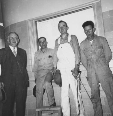 From left to right: Professor J. Sherman Horine (who did lettering), Sherman Sparks, Charles Grace, Pleas Allen (all placed names in wall case)