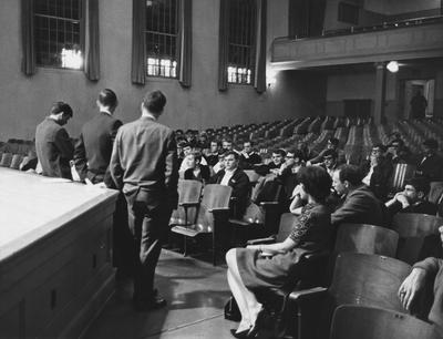 The Intra-Fraternity Council is holding a meeting in Memorial Hall. This allowed sorority and fraternity members to express themselves and try to settle differences with the administration. This photo appears first on page 84 in the 1969 