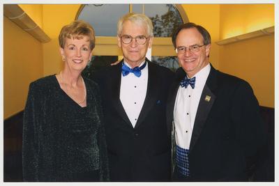 From the left:  Carole Boyd (wife of Doug A. Boyd), Doug A. Boyd (Chief of Staff), and President Lee Todd.  They are at a ceremony for the reopening of the Main Building
