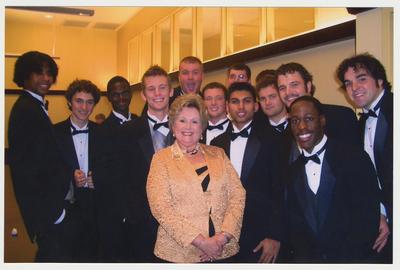 Patsy Todd is with the UK men's choral group the Acoustikats at a ceremony for the reopening of the Main Building