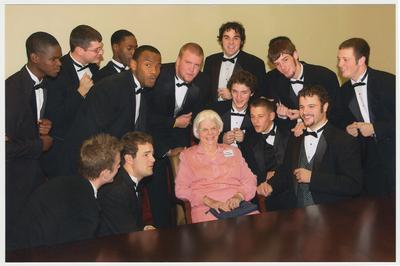 Betty Rosenthal is with the UK men's choral group the Acoustikats at a ceremony for the reopening of the Main Building