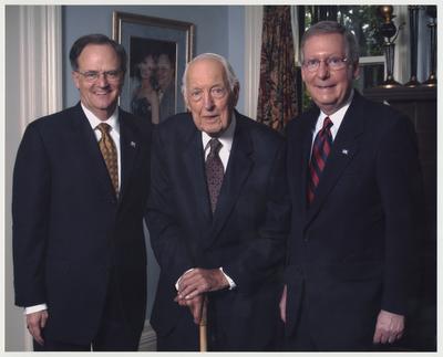 From the left:  President Lee T. Todd, State Historian Laureatte Thomas D. Clark, and US Senator Mitch McConnell (College of Law Alumnus.)  This photograph was taken in Maxwell Place as part of the festivities for the dedication of the Mitch McConnell Room in the College of Law