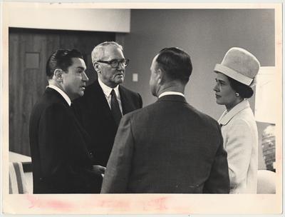 From the left:  Elvis Stahr, UK Alumnus, former Dean of the College of Law, and President of Indiana University; U. S. Senator John Sherman Cooper; Smith Broadbent, UK Alumnus and Board of Trustees member; Mrs. Broadbent.  They are talking to one another