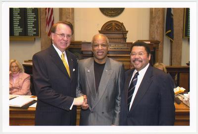 From the left:  House Speaker Jody Richards; Cecil R. Madison, Sr., UK Libraries; and Kentucky Representative Jesse Crenshaw.  This photograph was taken in the House Chamber