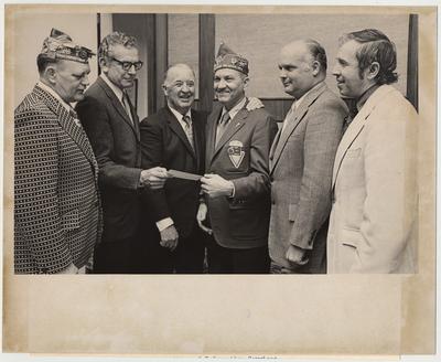 Members of the American Legion Forty and Eight present a check to the University of Kentucky to establish a clinical bacteriology research laboratory.  From the left:  Hoyt Marshall, Grand Director of Carville Star, Owensboro; UK President Otis A. Singletary; Former Governor A. B. 