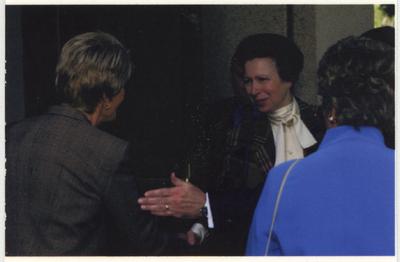 The Princess Royal Anne of Great Britain shakes the hand of an unidentified woman as UK First Lady Patsy Todd watches