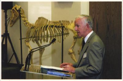 Peter Timoney, director of the Gluck Equine Research Center, speaks from a podium