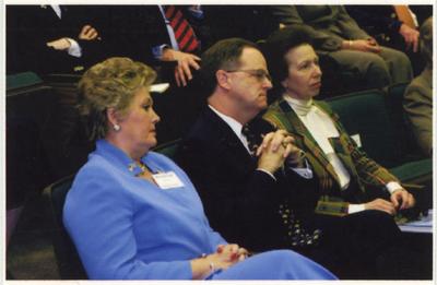 From the left:  UK First Lady Patsy Todd, President Lee Todd, and the Princess Royal Anne of Great Britain sit together in an auditorium