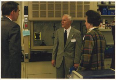 Peter Timoney, director of the Gluck Equine Research Center, speaks to an unidentified man.  From the left:  an unidentified man, Peter Timoney, and the Princess Royal Anne of Great Britain