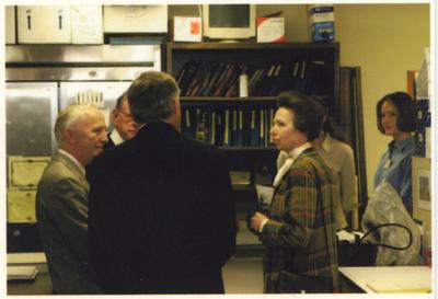 A group of people in a laboratory in the Maxwell H. Gluck Equine Research Center.  From the left:  Peter Timoney, director of the Gluck Center; two unidentified men; the Princess Royal Anne of Great Britain; and two unidentified women