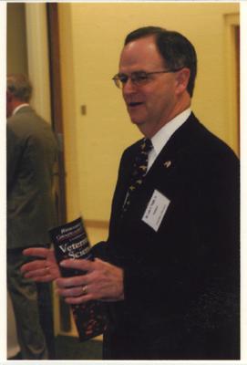 UK President Lee Todd holds a brochure about veterinary science