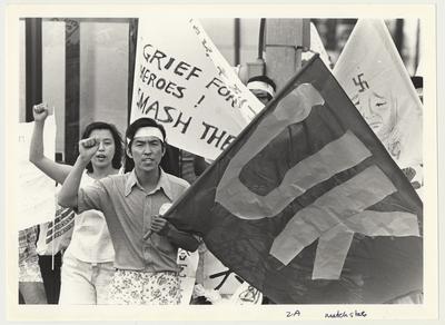 Student protesters with signs and flags