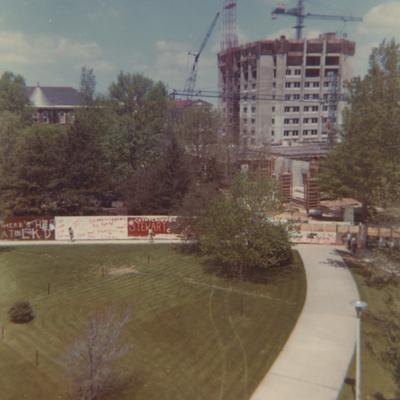 A color photo of the construction of White Hall Classroom Building (right) and Patterson Office Tower (next to White Hall) near the Administration Building (center) and Miller Hall (left). This photo was taken from the window in room 517 in King Library on April 25, 1968 and donated by Terry Warth