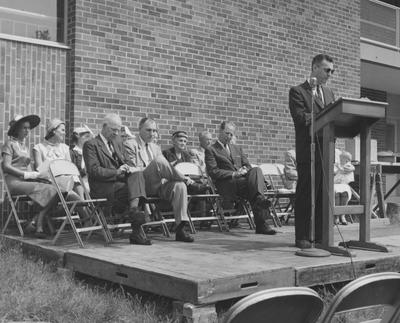 Dr. Dickey addresses a crowd at the Shawneetown Apartments dedication. Received May 21, 1958 from Public Relations