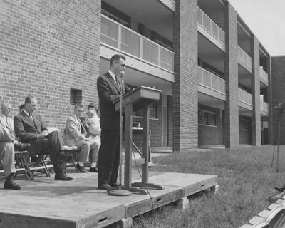 Dr. Dickey addresses a crowd at the Shawneetown Apartments dedication. Received May 21, 1958 from Public Relations
