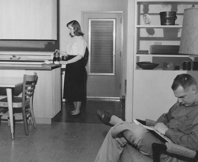 Ben Johnson (right) and his wife at their apartment at Shawneetown. Received March 21, 1958 from Public Relations