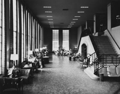 People socializing; interior of Student Union before remodeling
