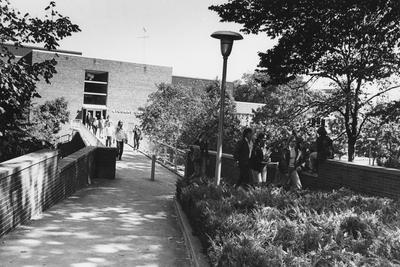 Student Center: first addition (1962), view from south, showing elevated walkway bridge connecting with southwest door of addition