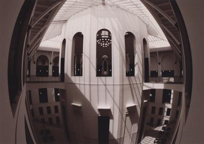 A sepia tone photo of the rotunda. This photo was taken from the third floor and the general seating area on the second floor can bee seen below. On the second floor inside the rotunda is the Traditional reading room where the indexes to periodicals can be found. This photo was taken before it's dedication in 1998. This photo was donated to UARP on May 1, 2003 by Teresa Burgett, Reference Librarian at Young Library