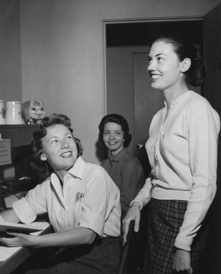 Three unidentified women laughing. Received April 30, 1958 from Public Relations