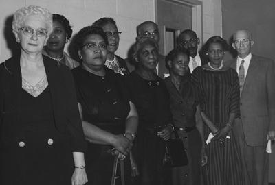Residence Hall employees awarded service pins. Left to right, front row: Mrs. Edith Potts, Mrs. Mary Bell Douglas, Mrs. Sophie Robinson, Miss Corine Lucas, and Mrs. Dorothy Rankin. Left to right, second row: Miss Anna Spotts, Mrs. Rosa Washington, Clifton Patterson, Leonard Washington and Frank D. Patterson, UK Vice President. Received March 5, 1959 from Public Relations